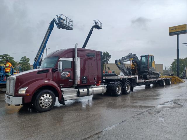 Excavator and lifts on a step deck